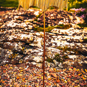 Large leopard lampshade set against a Scottish landscape